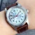 silver logo dial